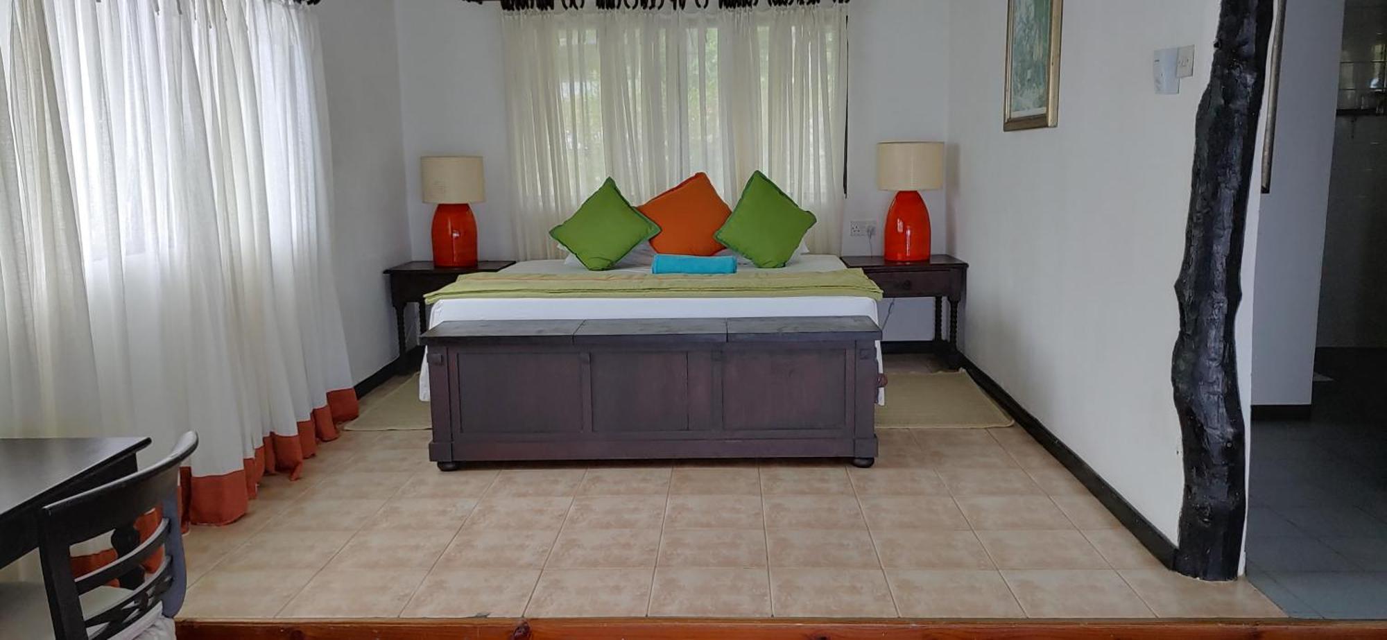 Mango Lodge Anse Volbert Village Habitación foto